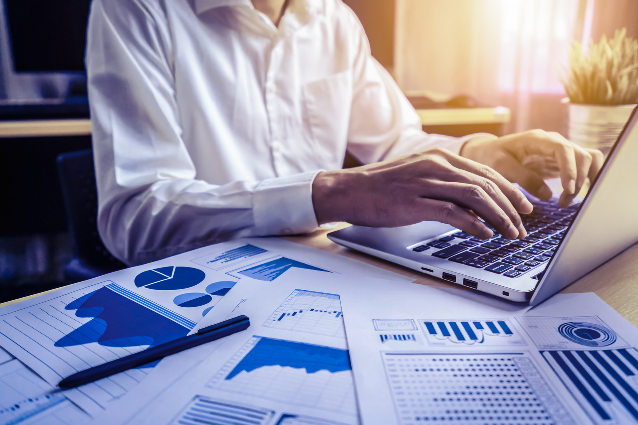 Businessman analyze data of stock market research.
